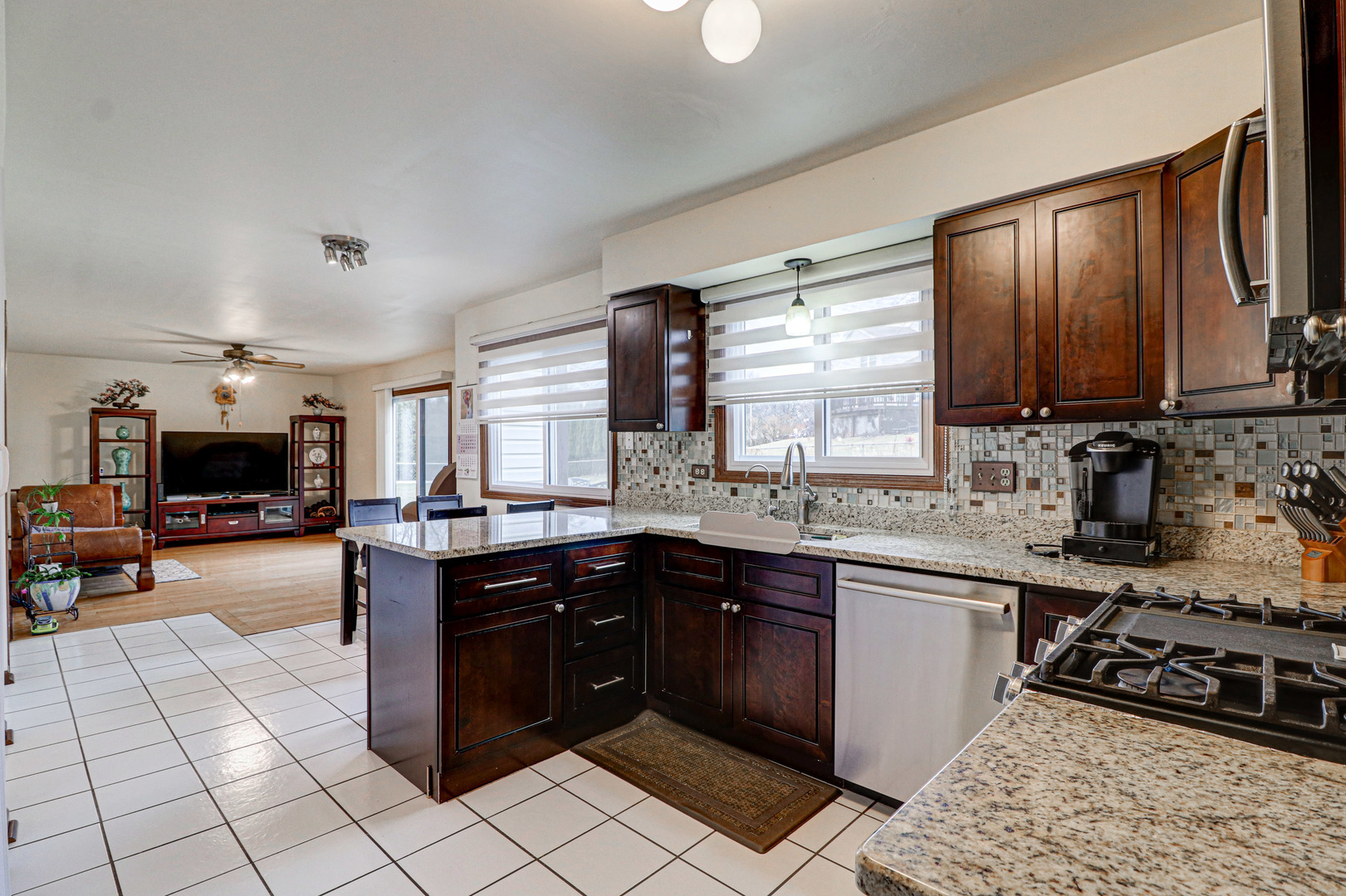 1126 Manchester Road Schaumburg, IL 60193 - Photo 8 of 28 a kitchen with stainless steel appliances granite countertop a sink a stove counter space and cabinets
