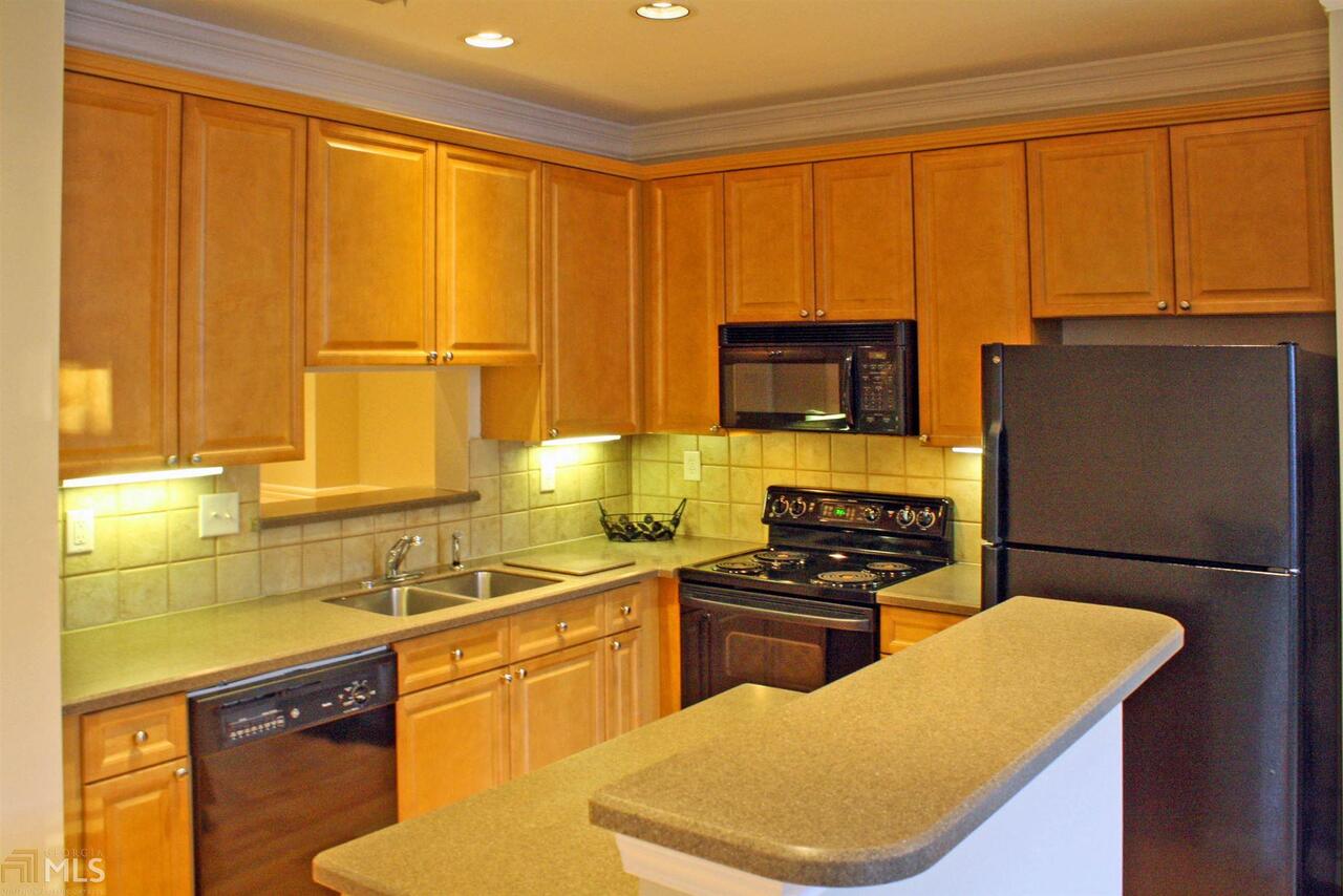 1405 Stratford Commons Decatur, GA 30033 - Photo 1 of 1 This L-Shaped kitchen with island, pass-through to dining room, and view of family room is perfectly positioned to be the center of your home.