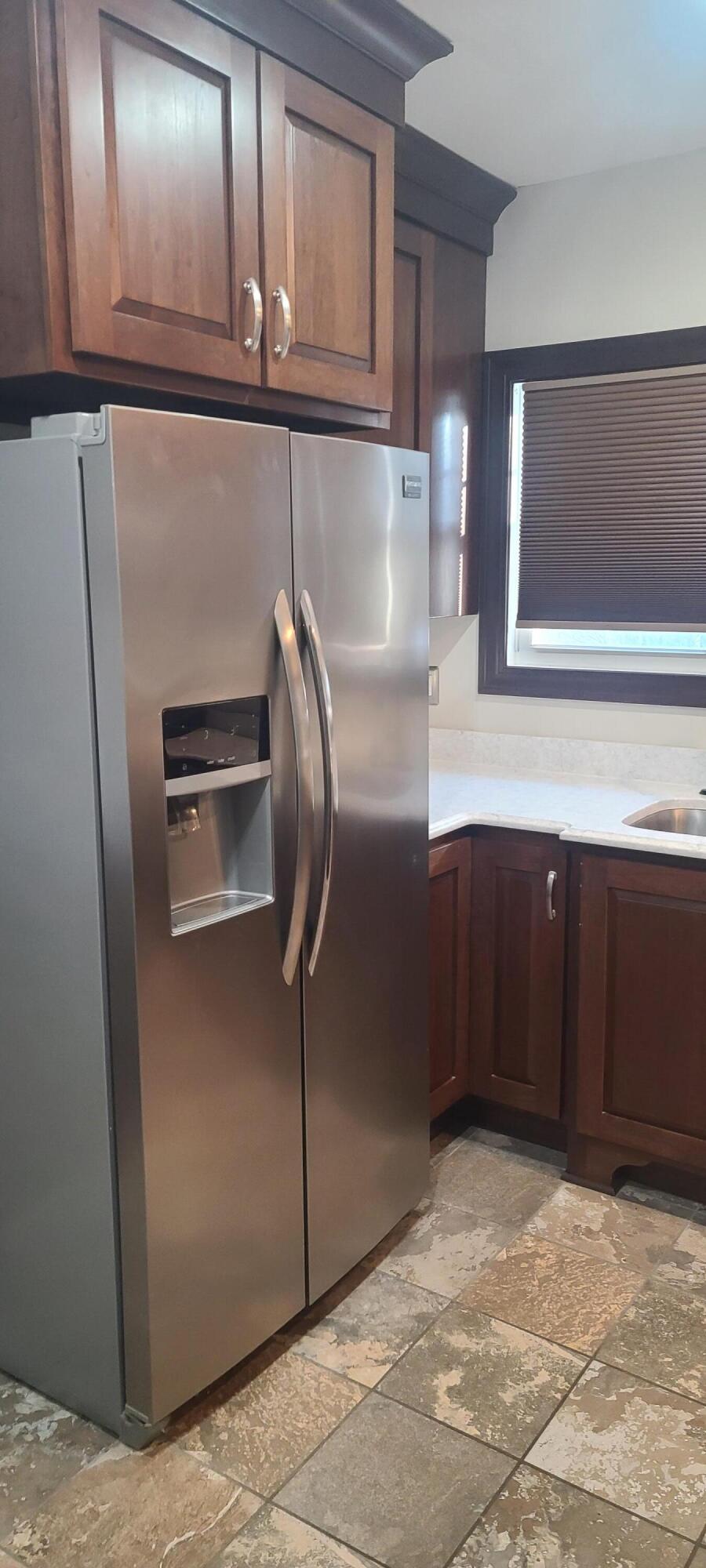 669 South 2nd Street Chesterton, IN 46304 - Photo 20 of 42 a kitchen with stainless steel appliances granite countertop a refrigerator and a sink