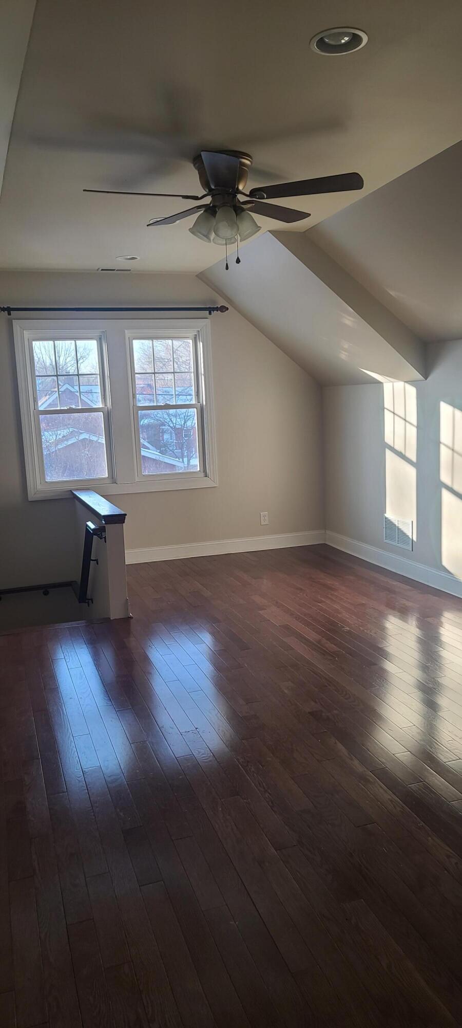 669 South 2nd Street Chesterton, IN 46304 - Photo 36 of 42 an empty room with wooden floor and windows