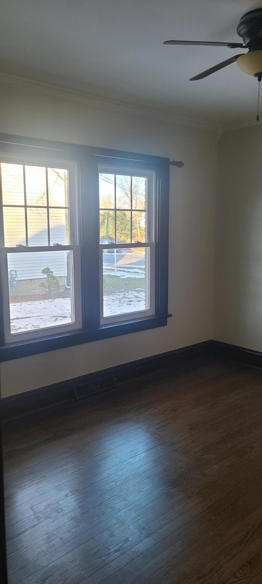 669 South 2nd Street Chesterton, IN 46304 - Photo 5 of 42 a view of an empty room with wooden floor and a window