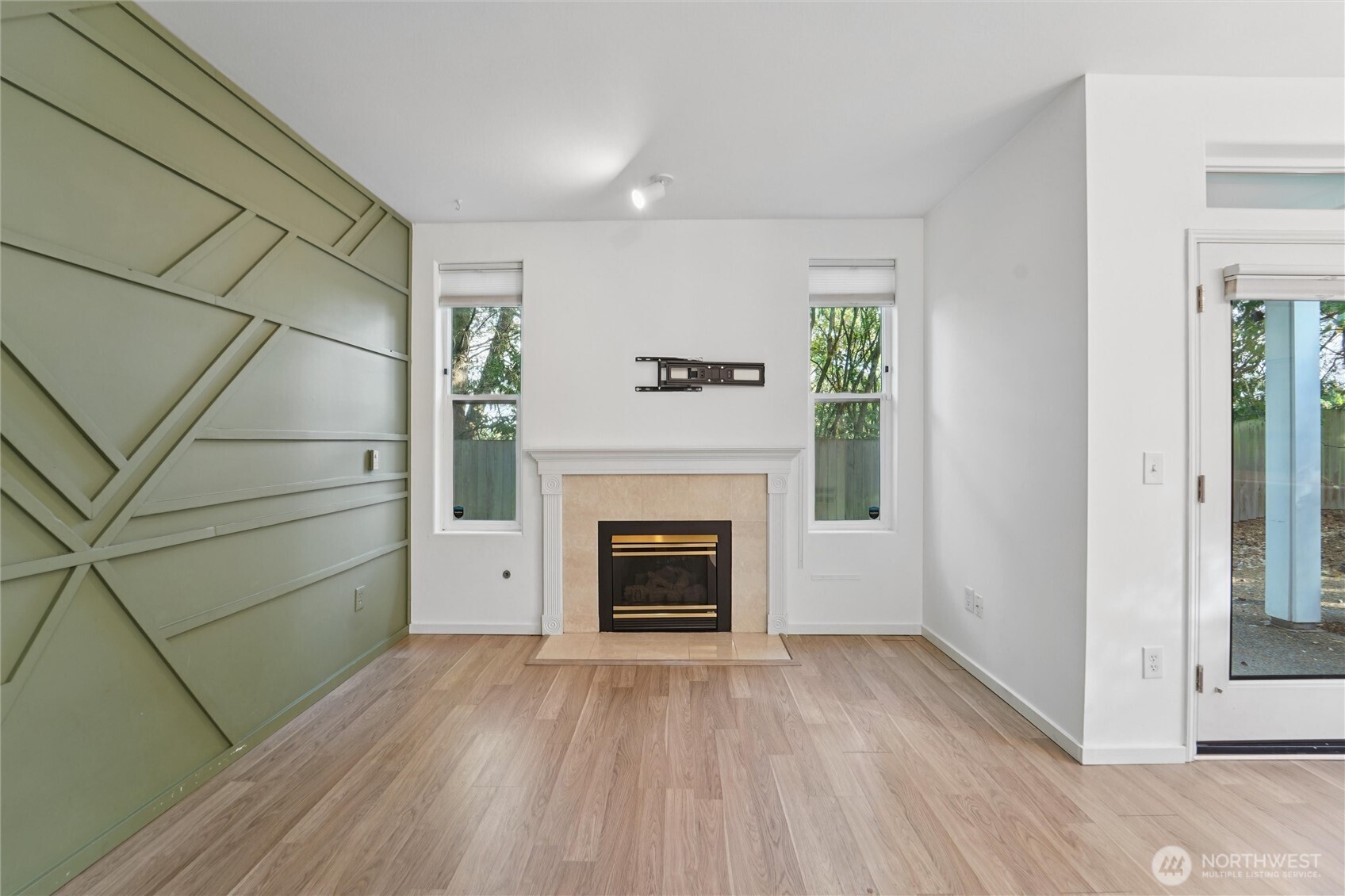 8515 244th Street Southwest, Unit A5 Edmonds, WA 98026 - Photo 5 of 20 a view of a livingroom with a fireplace and window