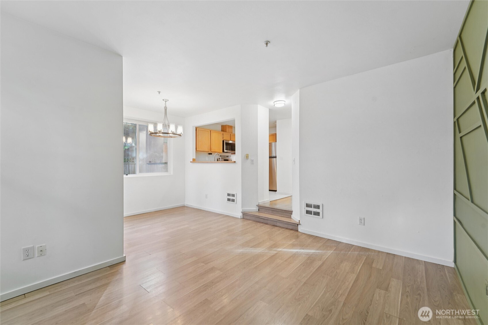 8515 244th Street Southwest, Unit A5 Edmonds, WA 98026 - Photo 7 of 20 an empty room with wooden floor and windows