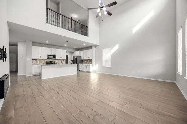 a view of a kitchen with a sink cabinets and stainless steel appliances