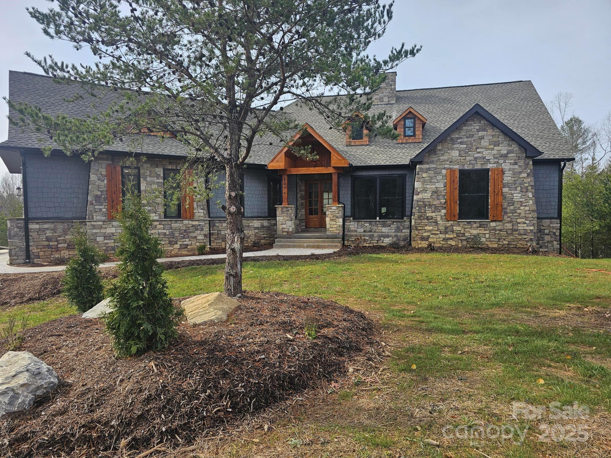 1076 Table View Drive, Unit 55 Morganton, NC 28655 - Photo 1 of 33 a front view of a house with garden