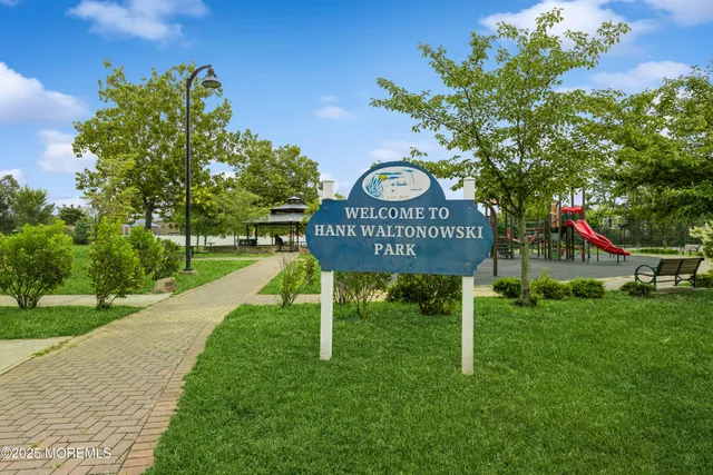 a view of a street with sign board