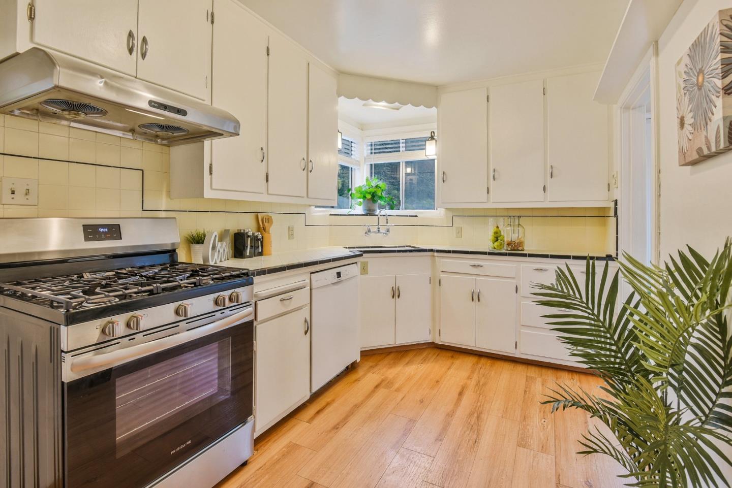 14 Belle Avenue San Rafael, CA 94901 - Photo 7 of 40 a white kitchen with sink and cabinets