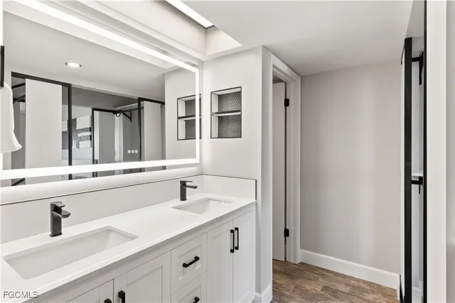 a bathroom with a sink and a mirror