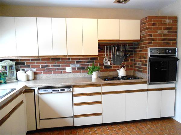 48 Meadowview Road Holyoke, MA 01040 - Photo 7 of 9 a kitchen with stainless steel appliances granite countertop a sink a stove and white cabinets