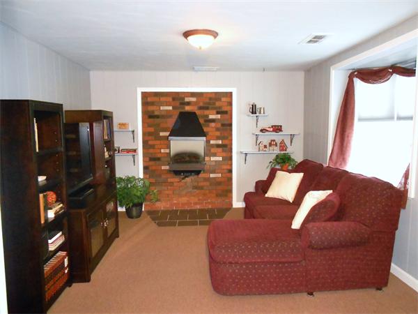 48 Meadowview Road Holyoke, MA 01040 - Photo 9 of 9 a living room with furniture and a flat screen tv