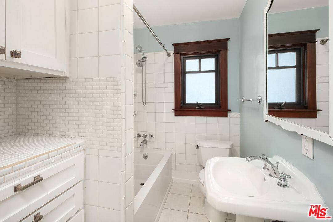 1436 Silver Boulevard Los Angeles, CA 90026 - Photo 15 of 31 a bathroom with a sink and a bathtub