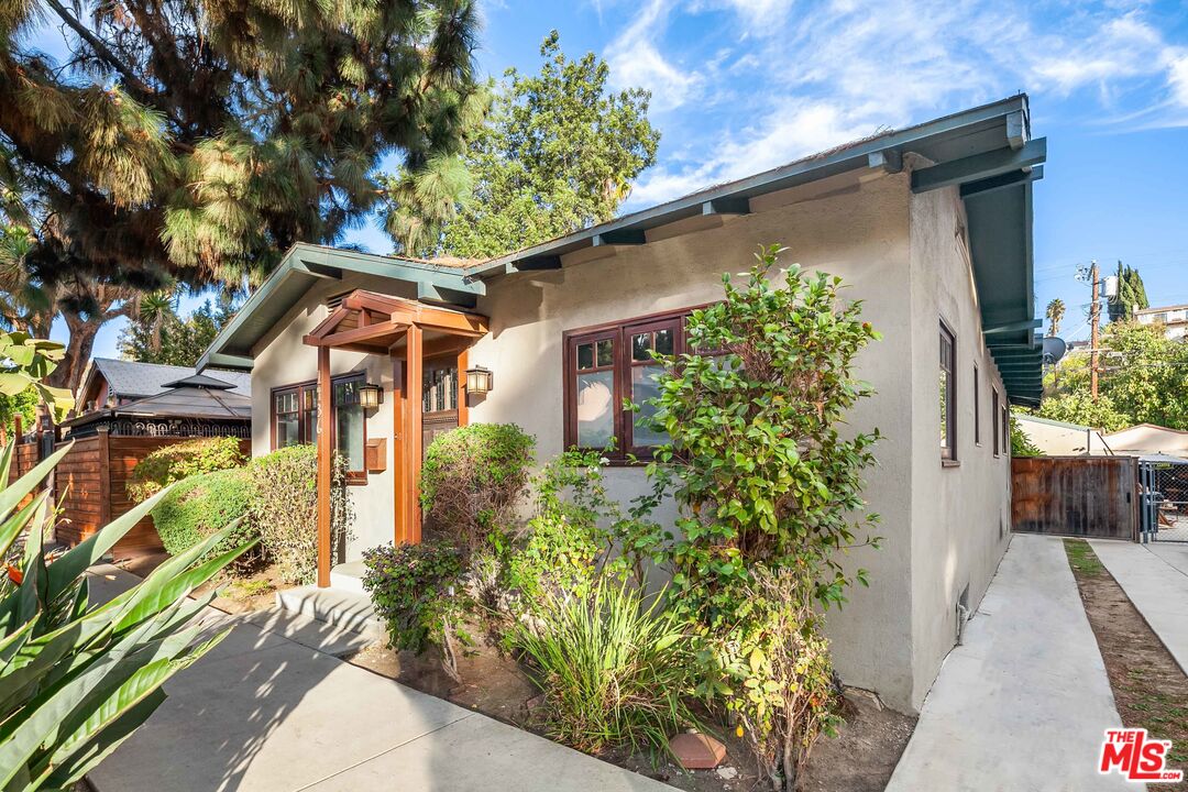 1436 Silver Boulevard Los Angeles, CA 90026 - Photo 3 of 31 a front view of a house with a yard