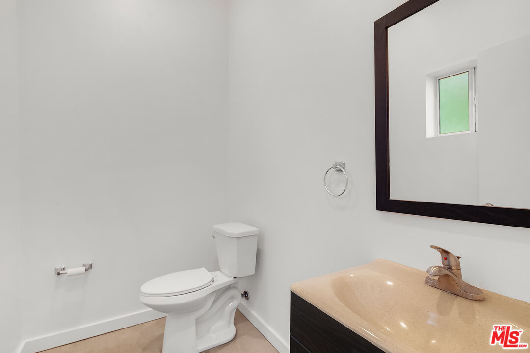 1436 Silver Boulevard Los Angeles, CA 90026 - Photo 29 of 31 a bathroom with a sink and a toilet