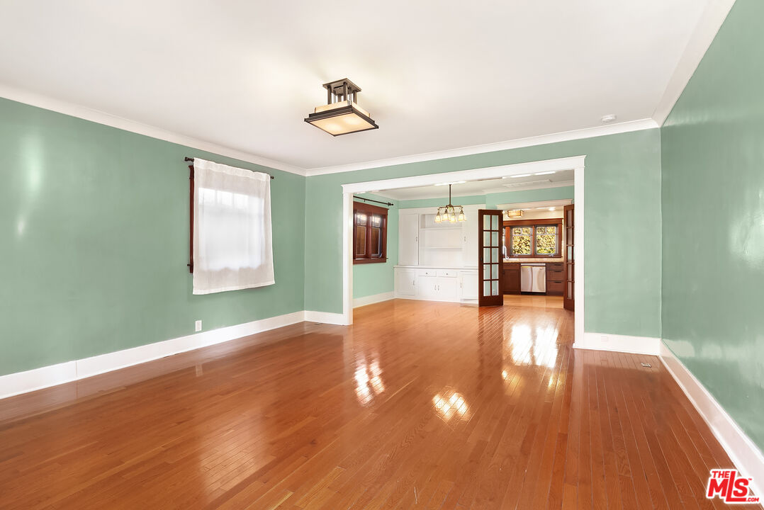 1436 Silver Boulevard Los Angeles, CA 90026 - Photo 4 of 31 a view of empty room with wooden floor and fan
