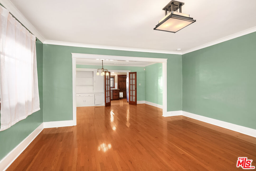 1436 Silver Boulevard Los Angeles, CA 90026 - Photo 5 of 31 a view of empty room with wooden floor and fan