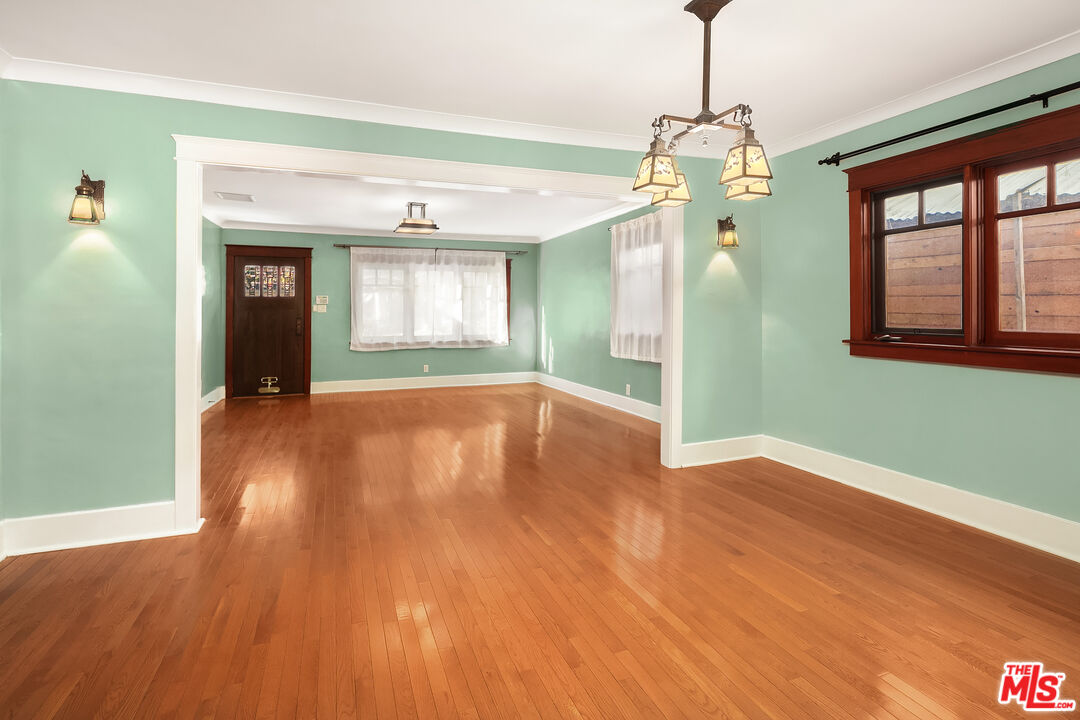 1436 Silver Boulevard Los Angeles, CA 90026 - Photo 7 of 31 a view of empty room with wooden floor and fan