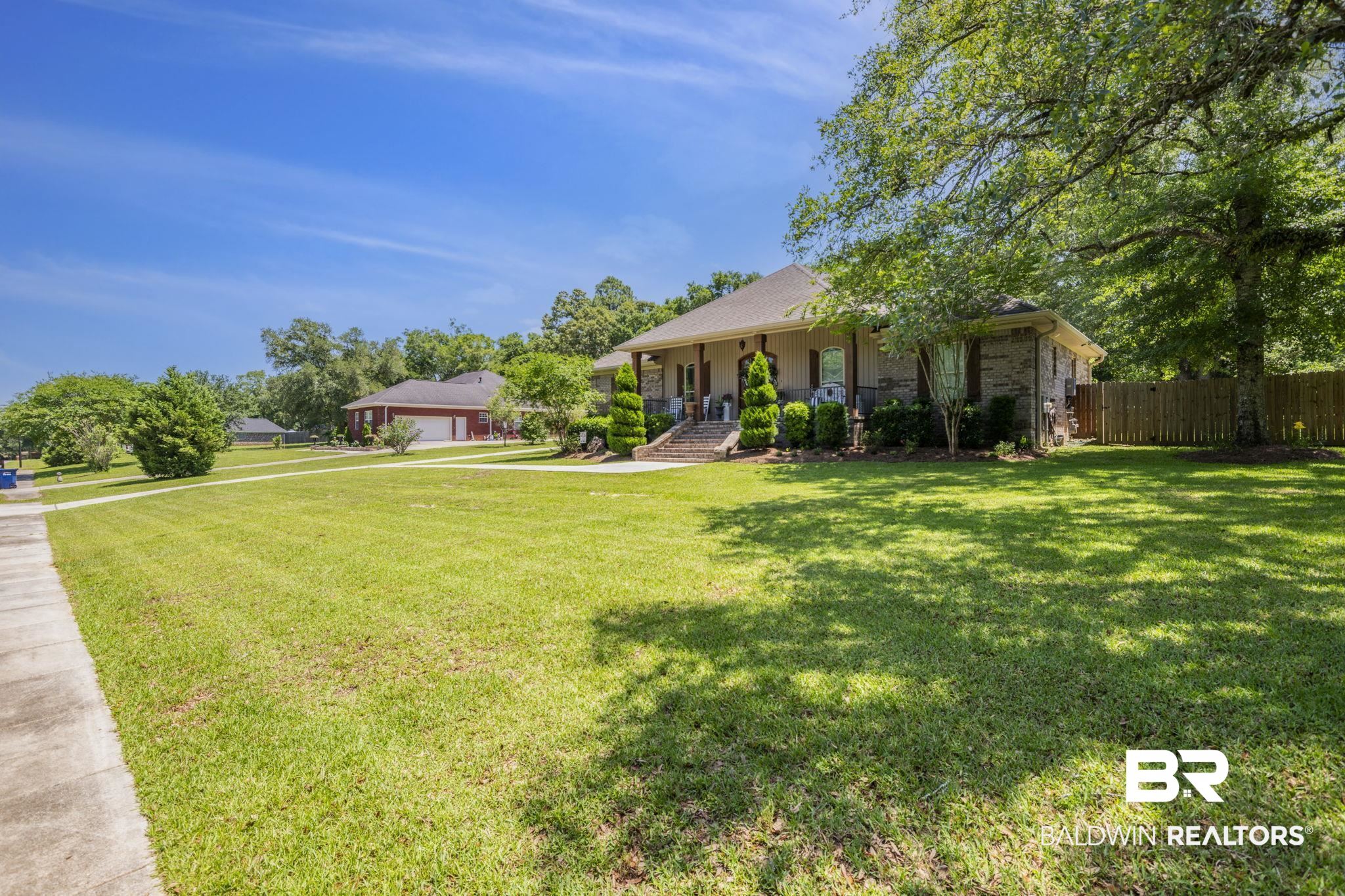 4331 Hamilton Oaks Lane Mobile, AL 36695 - Photo 34 of 38 View of yard with covered porch and a garage