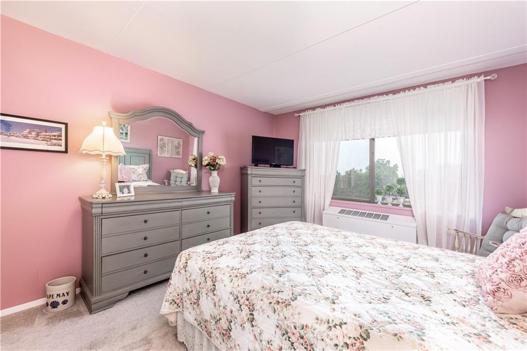 1150 Bower Hill Road, Unit 510B Pittsburgh, PA 15243 - Photo 20 of 25 a bedroom with a bed and a dresser