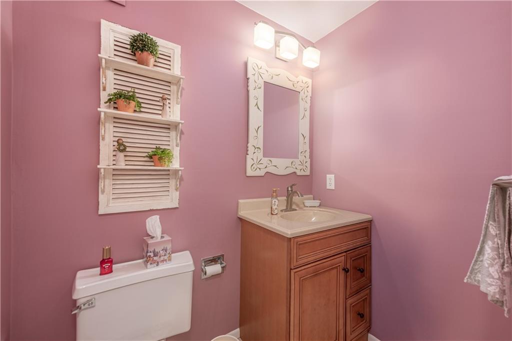 1150 Bower Hill Road, Unit 510B Pittsburgh, PA 15243 - Photo 7 of 25 a bathroom with a sink mirror and toilet