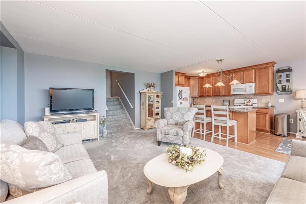 1150 Bower Hill Road, Unit 510B Pittsburgh, PA 15243 - Photo 10 of 25 a living room with furniture and a flat screen tv