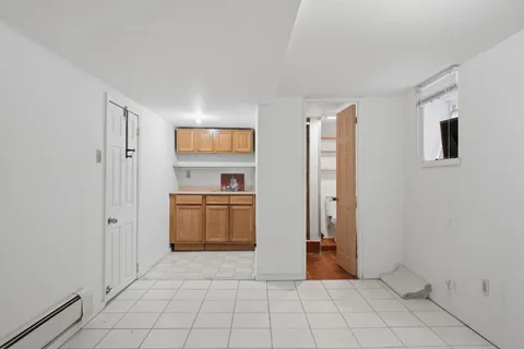 a view of a kitchen with a sink and a stove top oven