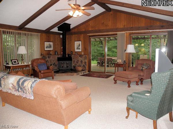 7204 Hartman Road Wadsworth, OH 44281 - Photo 7 of 20 Great room with fireplace stove and walk out to large deck