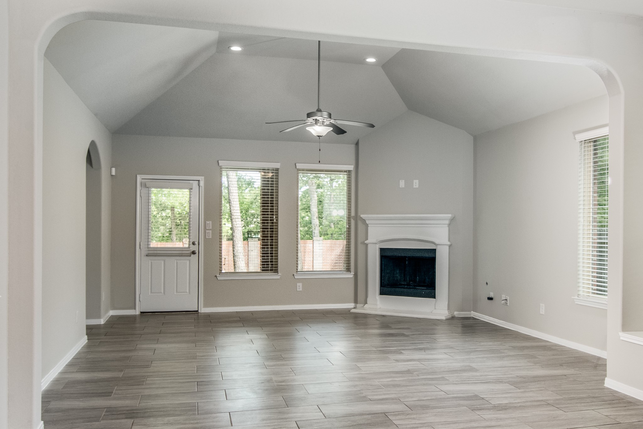 3211 Discovery Lane Conroe, TX 77301 - Photo 6 of 22 Living room space with a gas log fireplace