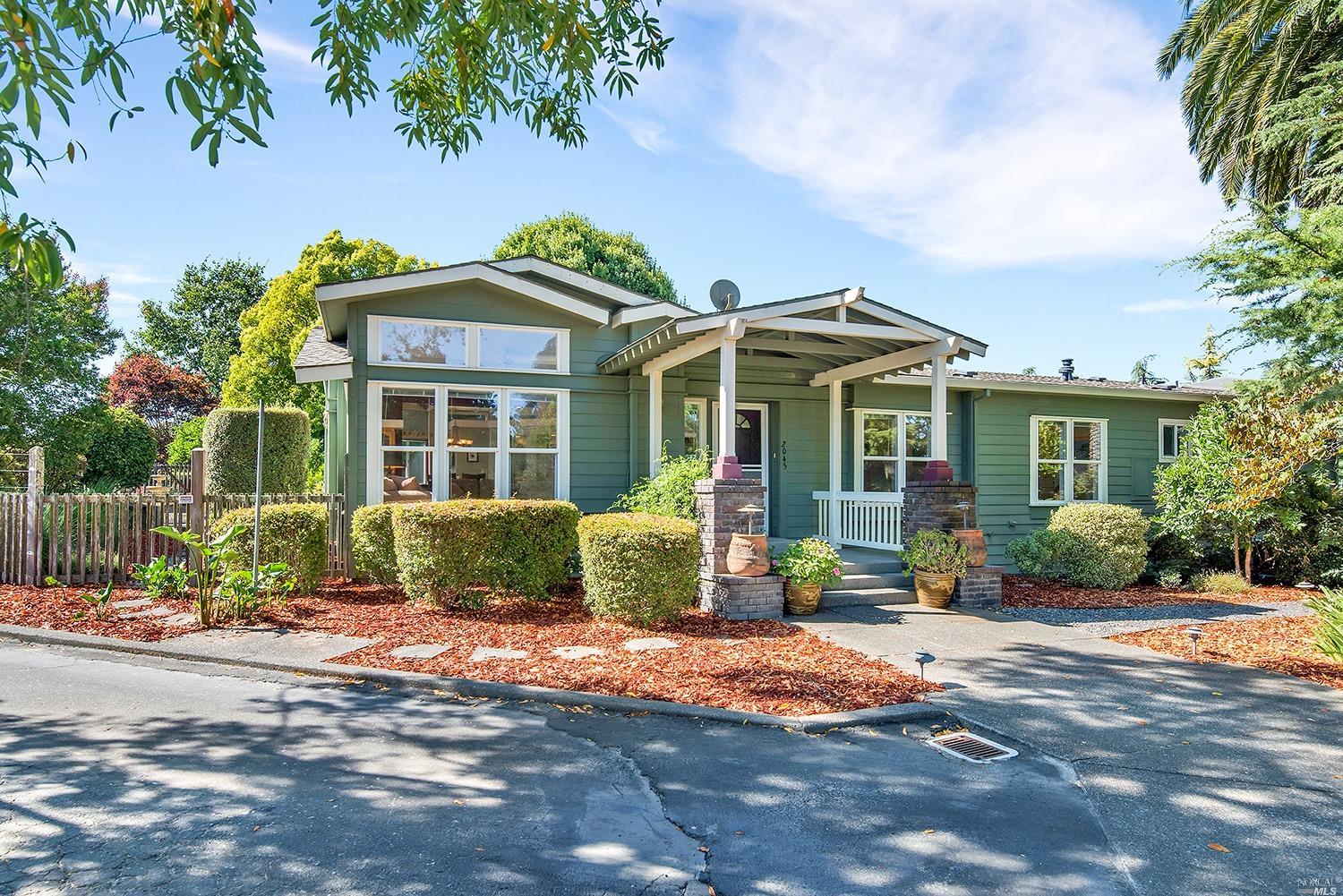 2045 Laguna Road Sebastopol, CA 95472 - Photo 1 of 1 a front view of a house with a yard and potted plants