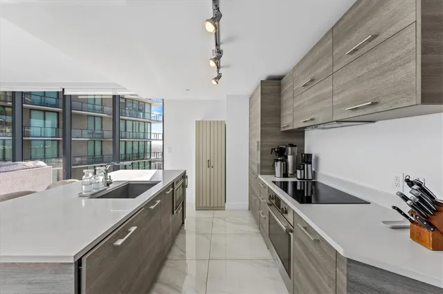 a kitchen that has a sink and a stove