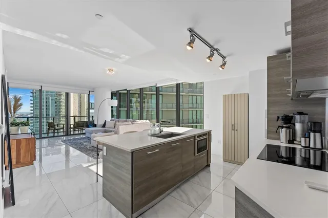 a room with a bed and a large window