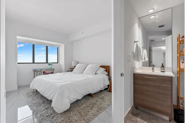 a bedroom with a bed and a dresser