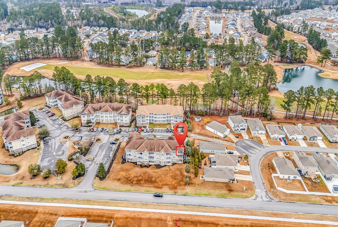 124 South Shore Boulevard, Unit 301 Longs, SC 29568 - Photo 25 of 27 Aerial overview of property's location with nearby suburban area, a nearby body of water, and a golf course