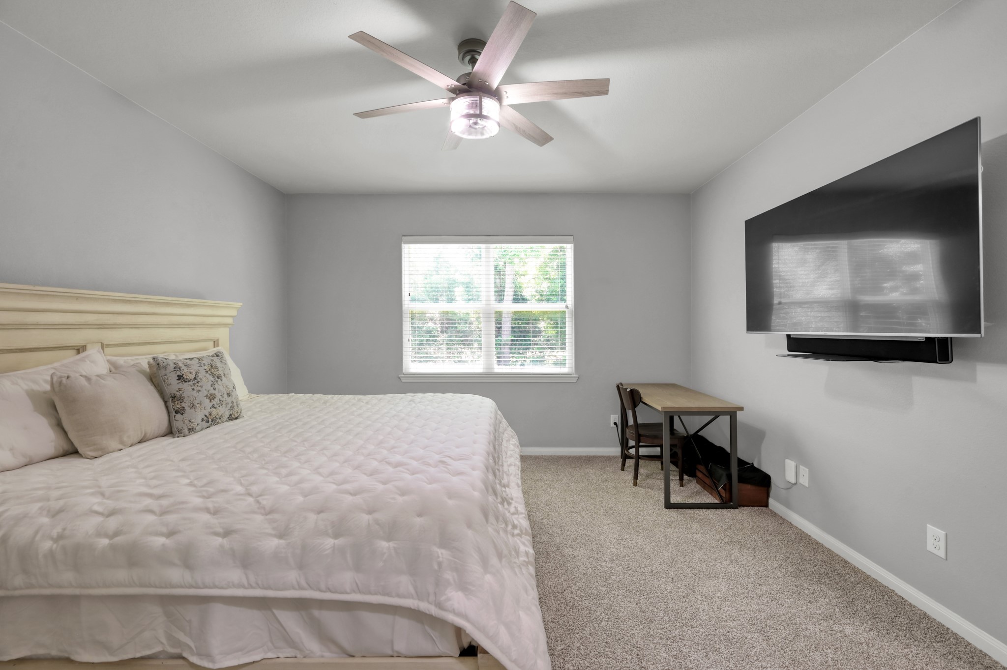 7562 Fettle Lane Conroe, TX 77304 - Photo 16 of 30 Comfortable primary bedroom offering privacy, natural light, and relaxing atmosphere.