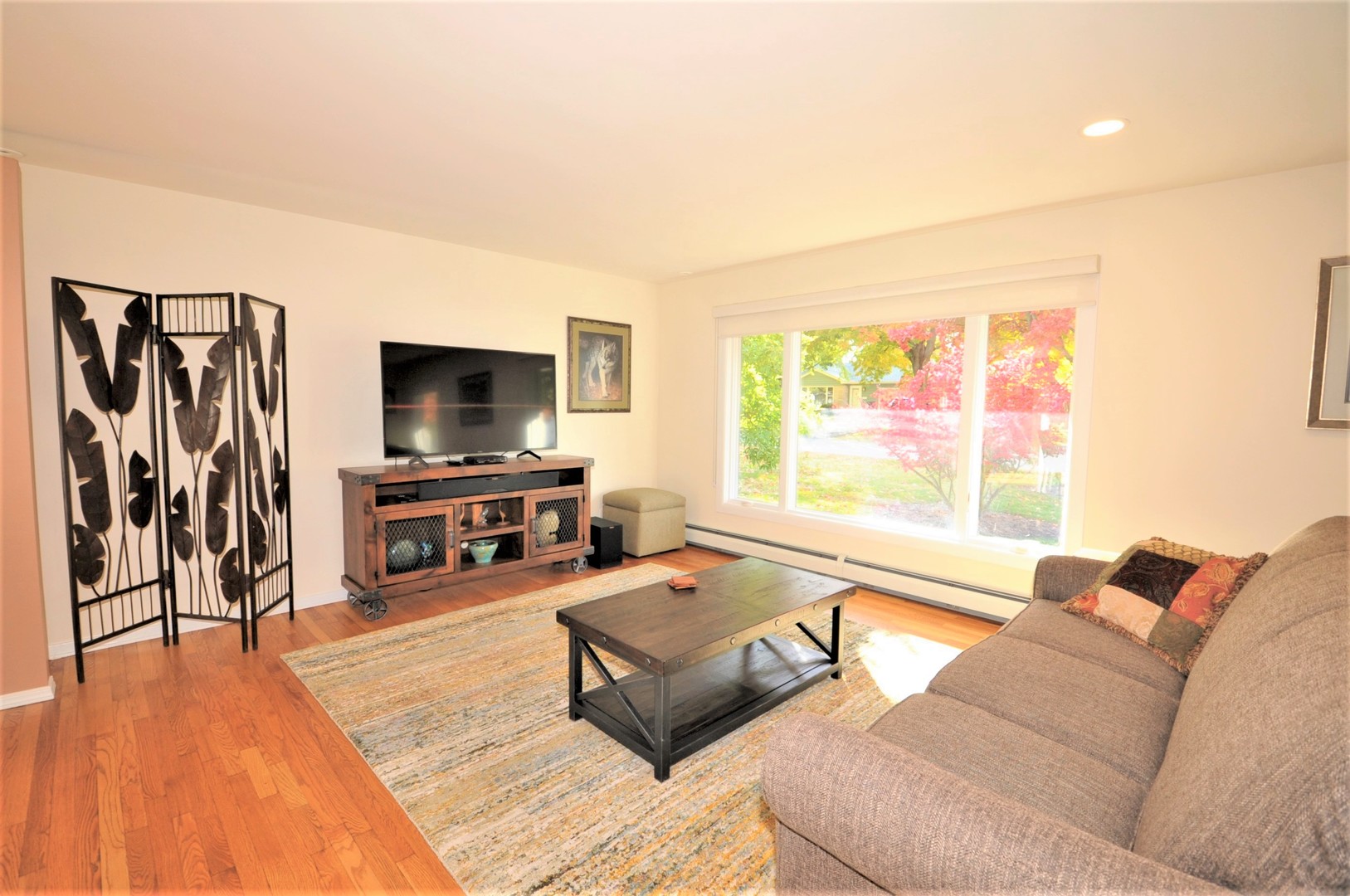 425 Maple Lane Geneva, IL 60134 - Photo 12 of 48 a living room with furniture and a flat screen tv