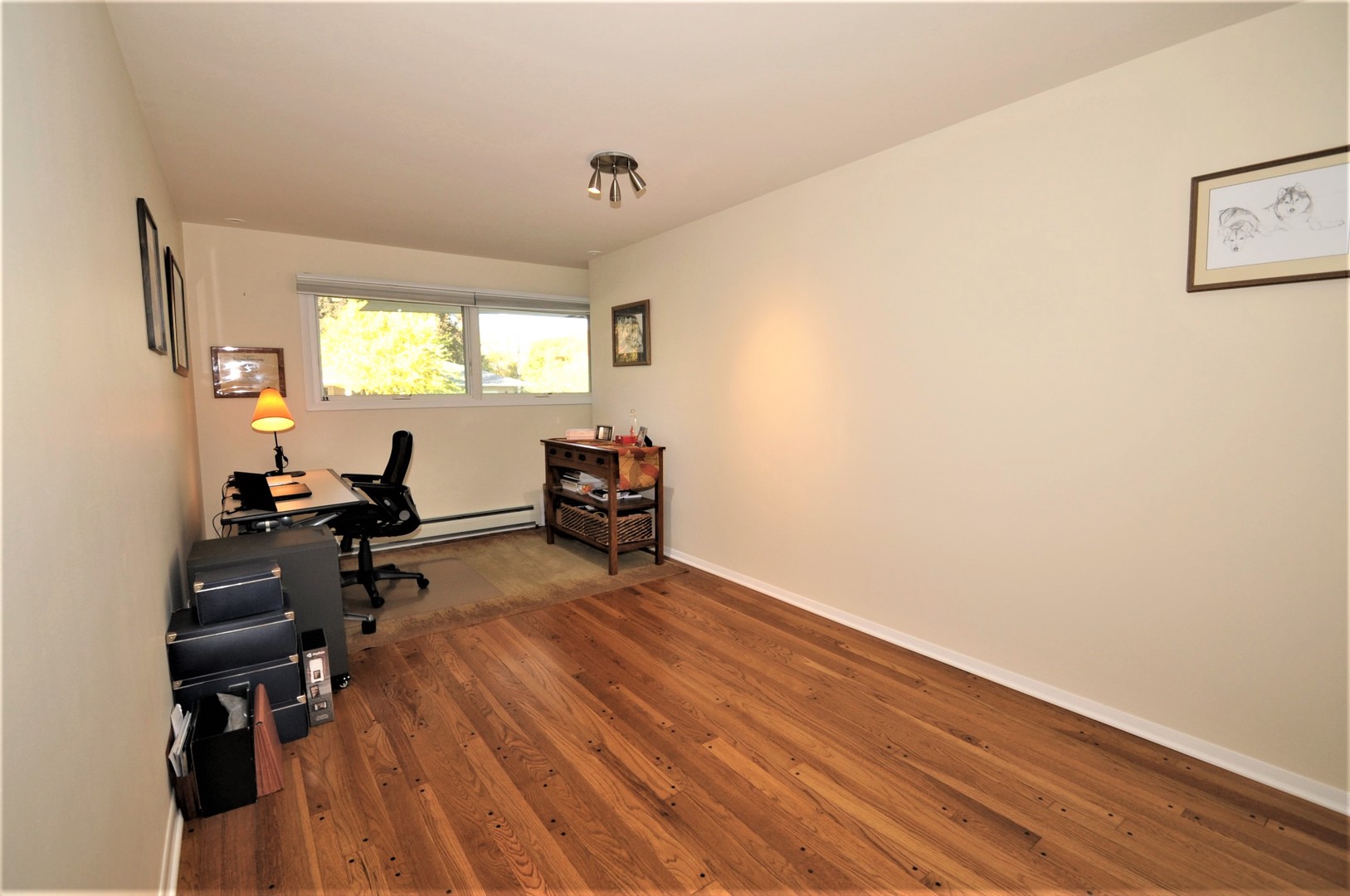 425 Maple Lane Geneva, IL 60134 - Photo 32 of 48 a view of workspace with wooden floor and windows