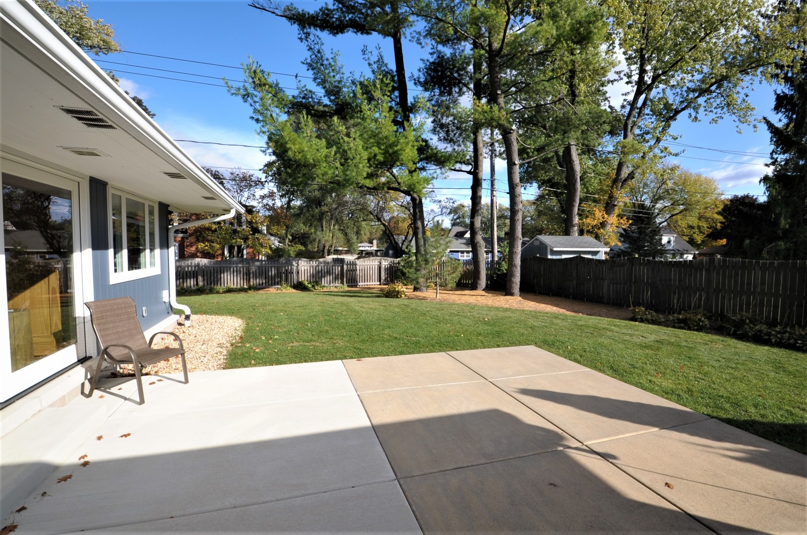 425 Maple Lane Geneva, IL 60134 - Photo 5 of 48 a view of a backyard with a garden and entertaining space