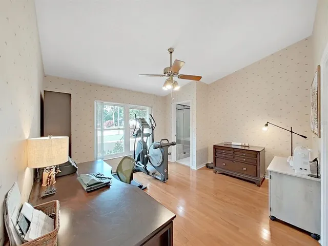 a spacious bedroom with a bed and window
