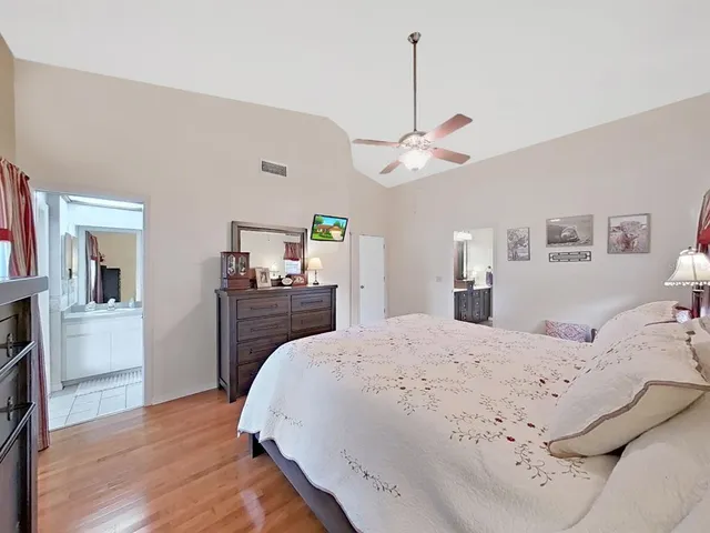 a en suite bathroom with a sink a mirror and a shower