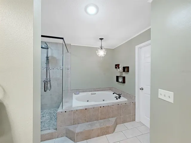 a dining room with furniture a rug and a painting