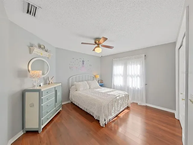 a large white kitchen with a large window