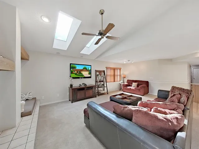 a dining room with furniture a rug and a large window