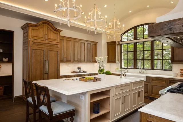 a kitchen that has a sink and a stove in it