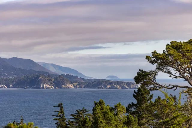 an aerial view of lake and mountain view