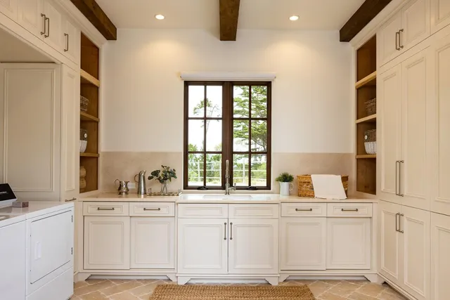 a bathroom with a sink and a large mirror