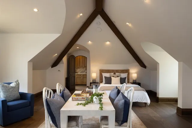 a bed room with furniture and wooden floor