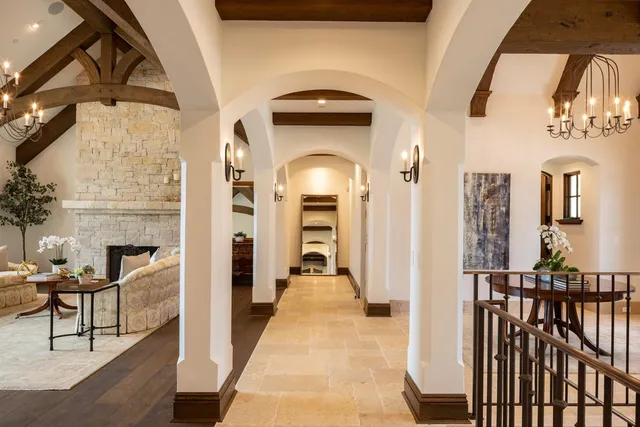 a view of a livingroom with furniture and staircase