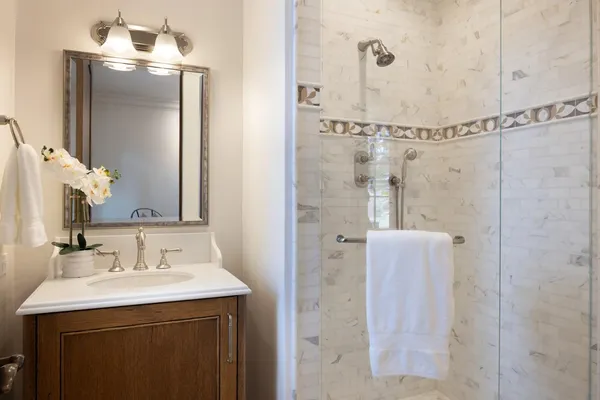 a bathroom with a sink and mirror