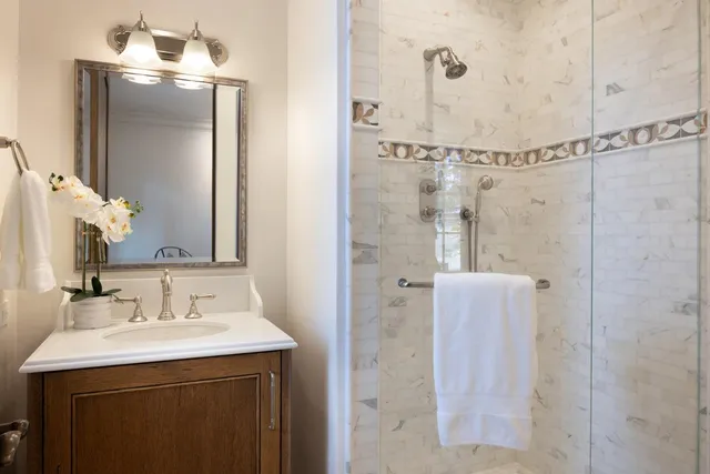 a bathroom with a sink and mirror