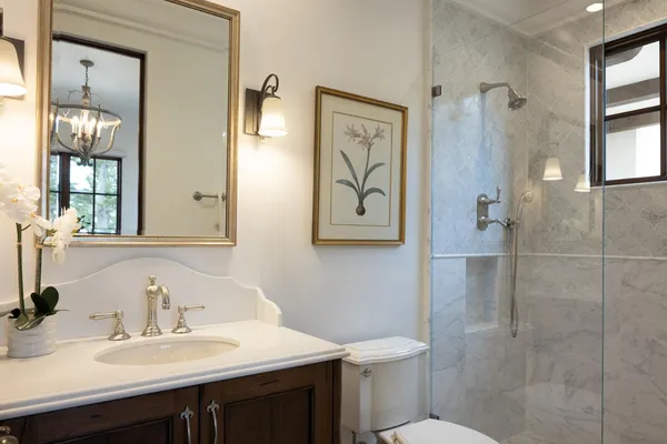 a bathroom with a sink toilet and shower