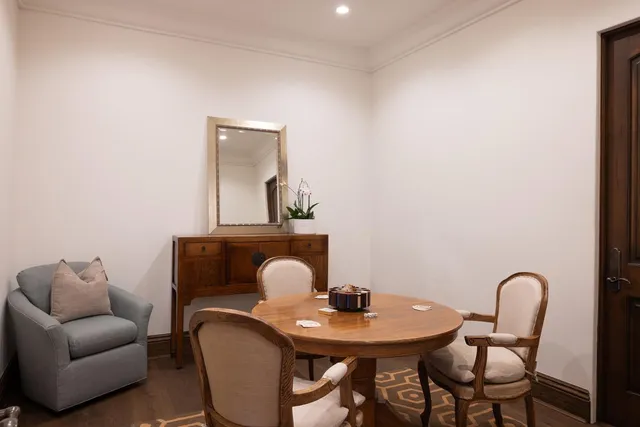a view of a livingroom with furniture and a table